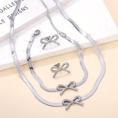 Silver bow necklace , bracelet and earrings set