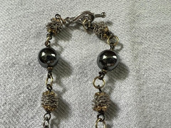 HEMATITE GRAY BEAD NECKLACE WITH SILVER/GOLD TONED SPACERS AND CABACHON PENDANT