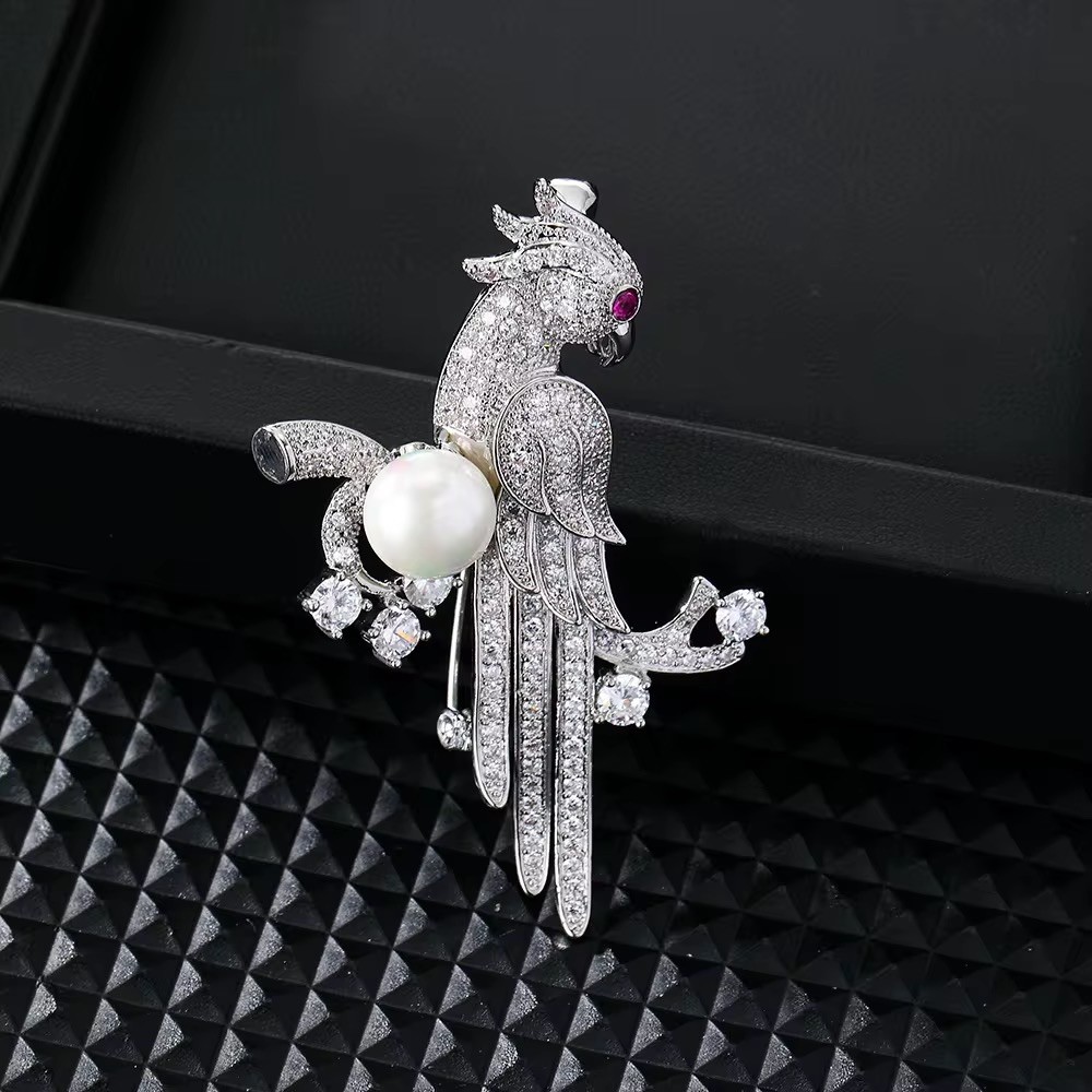 Luxury Silver Bird Brooch – Crystal Detailing, Pearl Accent & Ruby Eye