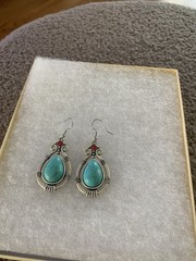 Major Turquoise Like Stone With Small Red Inlaid Stone Above Silver Tone Trim