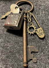 Padlock And Mixed Metal Skeleton Key