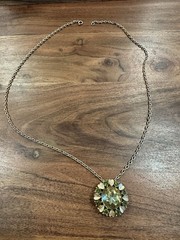 Vintage Avon necklace with green stones and hearts pendant/pin.