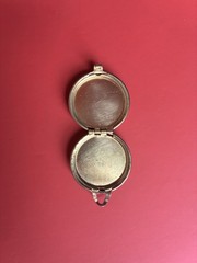 Round gold-tone brass locket