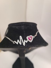 5.0mm Heart-Shaped Lab-Created Ruby and White Sapphire Frame Heartbeat Bolo Brac