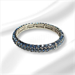 BRACELET. BLUE. ELASTIC. THREE ROWS BLUE RHINESTONES W/SILVER TONE HARDWARE