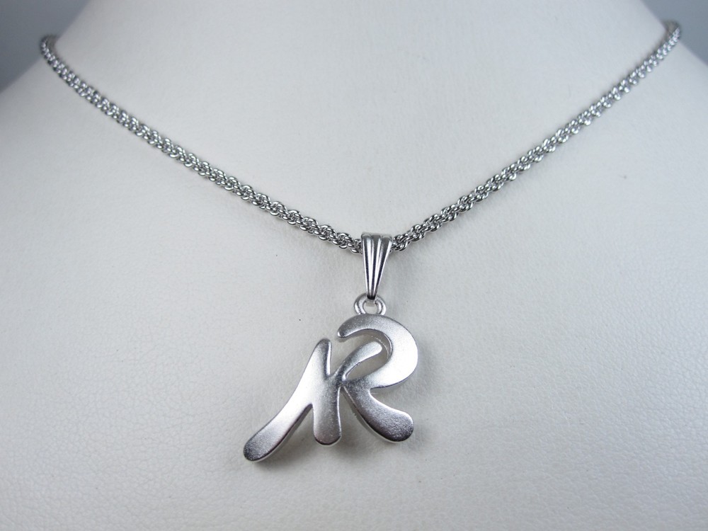 Nina Ricci Rhodium Plated Pendant 16-18″ – 9561