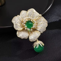 Luxury Gold Flower Brooch – Simulated Clear Crystals & Green Center Stone