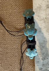leather cord wrap bracelet . adjustable closure . blue turtle dangle charms