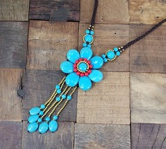 Large turquoise stone flower pendant necklace with beaded tassel and red stones
