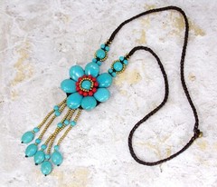 Large turquoise stone flower pendant necklace with beaded tassel and red stones