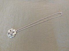Vintage green four-leaf clover pendent, with silver chain, new without tags